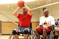 Sgt. 1st Class Kevin &quot;Smiley&quot; Hawkins focuses on making his shot during the 2015 Army Trials wheelchair basketball practice on Fort Bliss, Texas. (U.S. Army Medical Activity, Fort Drum, N.Y.)
