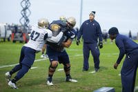 Lt. Col. Robert B. Green runs football players through drills during practice Nov. 17, 2015, at the U.S. Naval Academy in Annapolis, Maryland. (Photo: Sgt. Terence Brady)