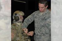 First Lt. Anthony Eastin clips the tablet into the Bat Rack, a mounting device created by the Battlefield Air Targeting Man-Aided Knowledge team in the 711th Human Performance Wing's Airman Systems Directorate. (Photo: Gina Marie Giardina)