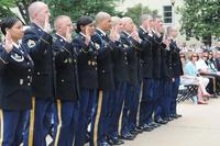 FILE - 13 Soldiers re-enlist in the Pentagon courtyard during a cake-cutting celebration of the Army's 239th birthday on June 19, 2014. (Photo Credit: Libby Howe)