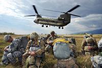 Paratroopers from 173rd Brigade Support Battalion, 173rd Airborne Brigade, prepare to board a 12th Combat Aviation Brigade CH-47 Chinook helicopter for an airborne operation, at Juliet Drop Zone, in Pordenone, Italy. (Photo Credit: Paolo Bovo)