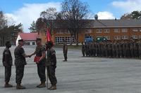 Lt. Gen. John Wissler, commander of Marine Corps Forces Command, congratulates Capt. Mark Edgar, commander of Bravo Company, 1st Battalion, 2nd Marines, during an Arctic Service Ribbon ceremony at Vaernes Garrison, Norway. (Military.com/Hope Hodge Seck)