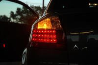 Left turn signal on a black car.