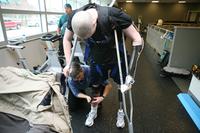 A patient in a Warrior Transition Unit receives assistance from a worker in this undated Army file photo. (US Army photo)