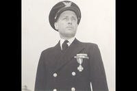 A photo of Quentin Walsh receiving the Navy Cross. (U.S. Coast Guard photo)