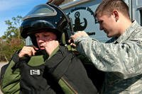 Staff Sgt. Travis Groeschel, an EOD technician with the 96th Civil Engineer Group, is outfitted in his bomb suit before performing a demonstration at Eglin Air Force Base, Fla. (US Air Force photo/Samuel King Jr.)