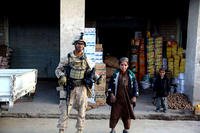 U.S. Marine combat correspondent Brian Gabriel, left, during his deployment to Helmand Province, Afghanistan in 2010-2011. Five years later, he is the senior press and media operations assistant at the White House. (Courtesy photo)