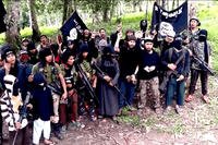 This video screengrab shows several members of Abu Sayyaf, one of several militant groups in the Philippines to have pledged allegiance to ISIS. (Abu Sayyaf)