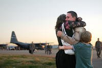 A member of the 123rd Airlift Wing gets a welcome-home hug from loved ones at the Kentucky Air National Guard Base in Louisville, Ky.  (Photo: U.S. Air Force/Master Sgt. Phil Speck)