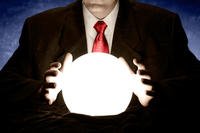 Businessman consulting glowing crystal ball (Image: Flickr/InfoWire.dk)