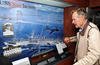 ATLANTIC OCEAN - JULY 14: In this handout image provided by the U.S. Navy, former President George H.W. Bush looks at a display of his former ship, the aircraft carrier USS San Jacinto (CVL 30), in the tribute room of the aircraft carrier that bears his name, USS George H.W. Bush (CVN 77) July 14, 2010 in the Atlantic Ocean. Bush and former first lady Barbara Bush spent their time onboard watching flight operations, touring the ship and visiting with the crew. The George H.W. Bush is conducting training in 