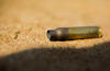 A 5.56mm cartridge after being fired from an M4 carbine rifle