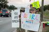 Airmen hold suicide prevention n messages of support.
