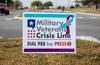 A sign for the Military and Veterans Crisis Line.