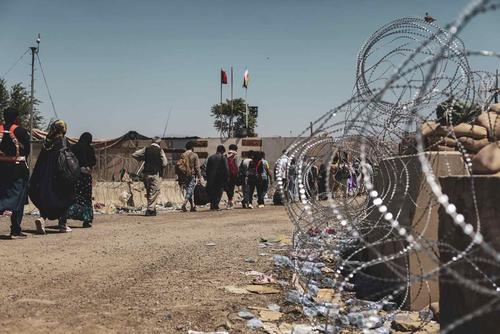 Evacuees processed during evacuation at Hamid Karzai International Airport