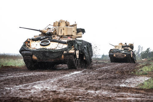 U.S. soldiers assigned to Alpha Company, 1st Battalion, 9 Calvary Regiment, drive an M2 Bradley fighting vehicle during a fire support coordination exercise as part of Griffin Shock 23 at Bemowo Piskie, Poland.