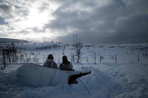 Marines scan their sectors of fire during training exercise in Norway