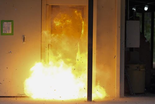 A U.S. special forces soldier sets off a traditional explosive charge that's noticeably larger than recently-developed breaching charges