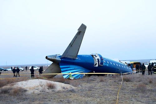 A part of Azerbaijan Airlines' Embraer 190 lies on the ground near the airport of Aktau, Kazakhstan.