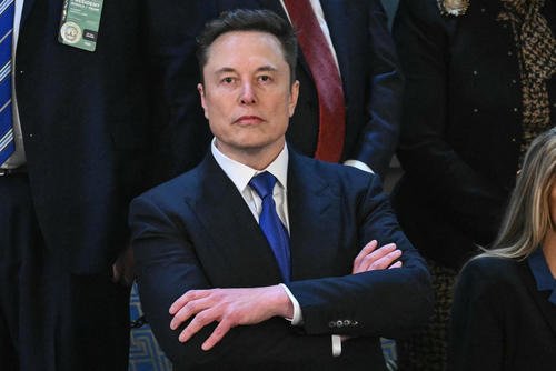 Elon Musk arrives for President Donald Trump's address to a joint session of Congress in the House chamber of the U.S. Capitol.