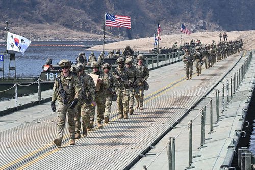 U.S. soldiers cross a river over a floating bridge during a joint river-crossing exercise between South Korea and the U.S. as part of the Freedom Shield 25 training in Yeoncheon, South Korea.