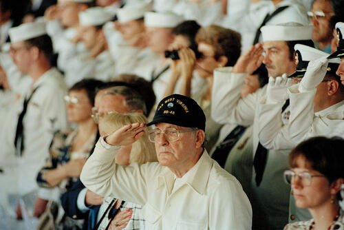 Pearl Harbor survivor Archie Odom salutes
