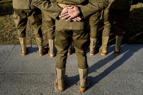 The Army's 1st Cavalry Division Honor Guard from Fort Hood, Texas stands during a Veterans Day ceremony at the World War II Memorial in Washington, Thursday, Nov. 11, 2021, hosted by The Friends of the National World War II Memorial and the National Park Service to pay tribute to those who served in WWII and the over 400,000 servicemen who were killed. (AP Photo/Andrew Harnik)