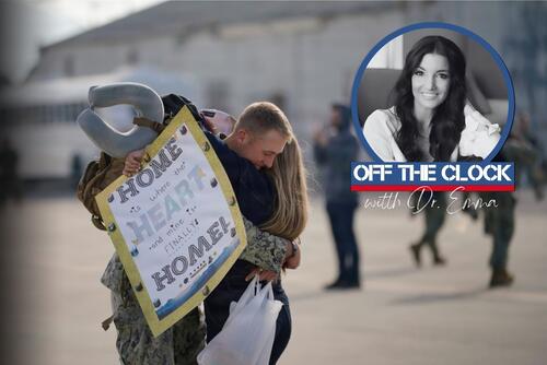 A couple hugs at a deployment homecoming.