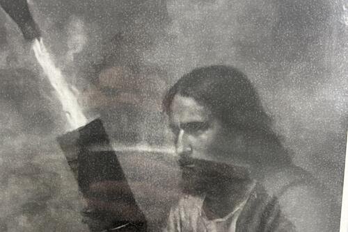 A picture of Jesus firing a mortar was allegedly found by a U.S. Army noncommissioned officer in a working area, prompting concerns about religion within the ranks. (MRFF)